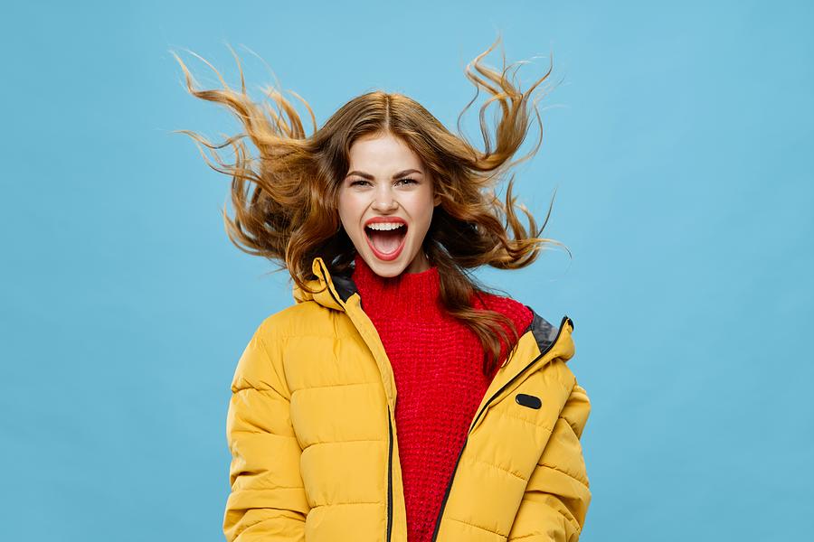 Joyful Young Woman With Red Hair In Warm Winter Clothes Laughing Fun Photograph by ShotPrime