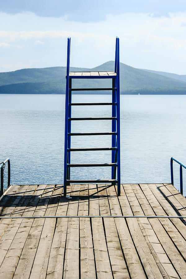 Jump tower on the bridge boat on lake in summer Photograph by Andrei Troitskiy