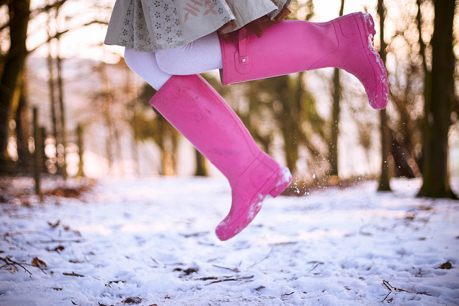 Jumping with pink boots Photograph by Olivia Bell Photography