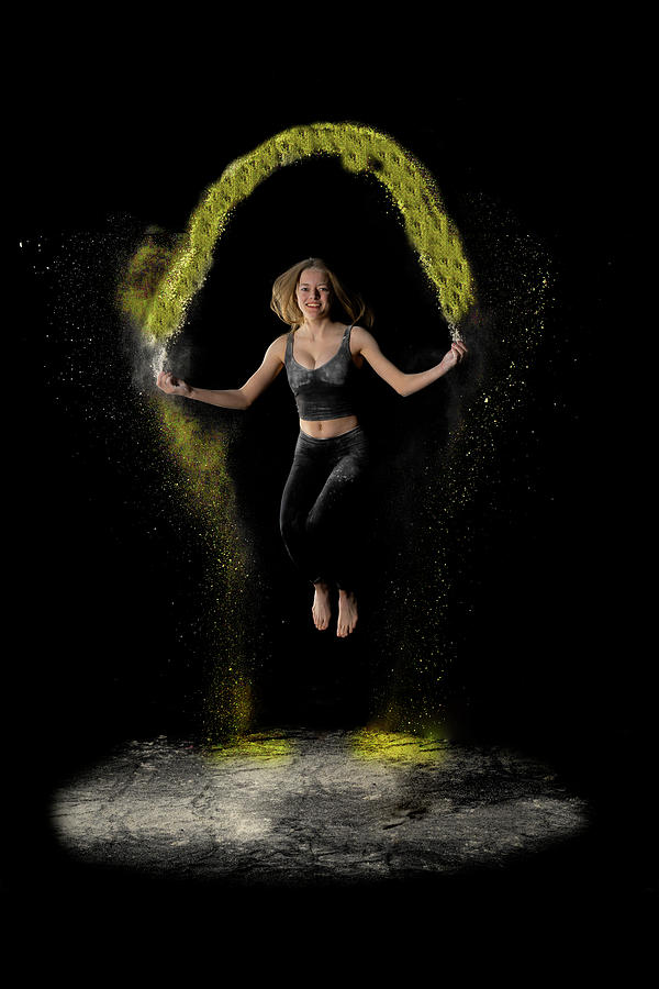 Jumping yellow rope flour Photograph by Dan Friend