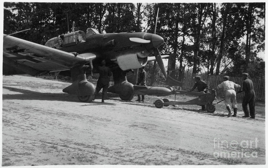 Junkers Ju87 loading Photograph by Oleg Konin