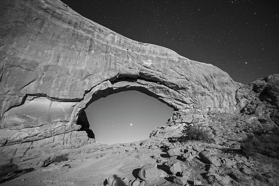 Jupiter and Saturn through the North Window in Arches National Park Moab Utah Starry Sky BW Photograph by Toby McGuire