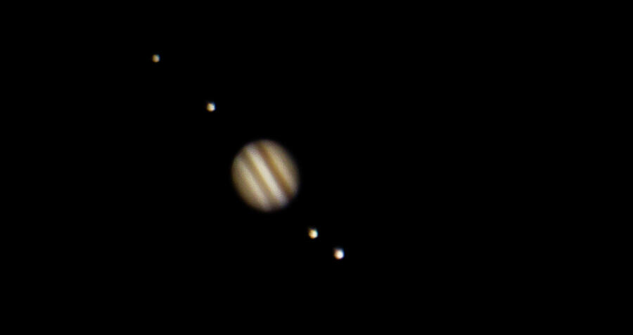 Jovian Serenade Jupiters Dance with its Moons Photograph by Gregg Ott