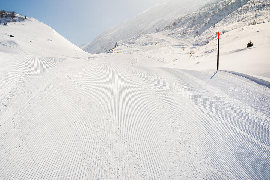 Just groomed ski slope in Andermatt, Canton Uri, Switzerland Photograph by Ina Tsitovich