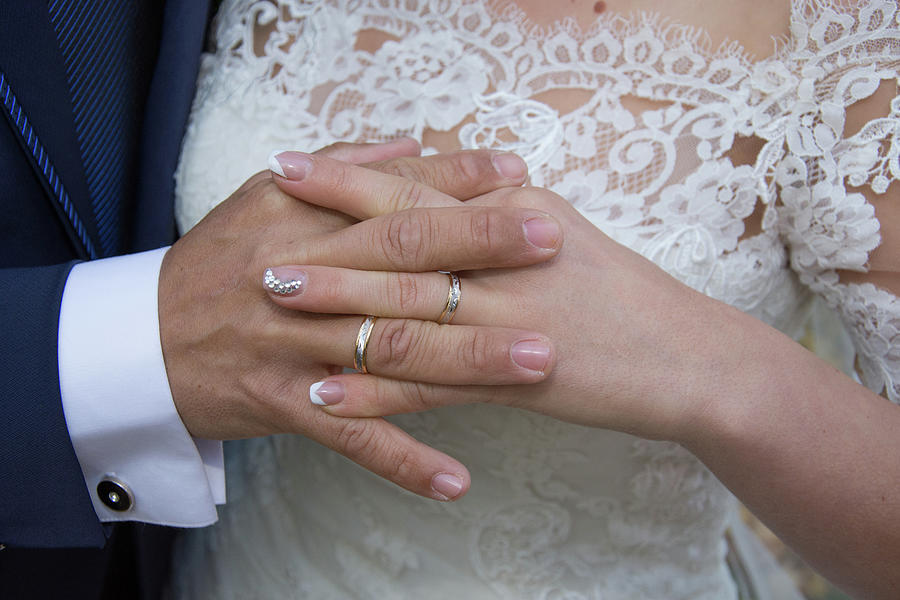 Just married couple showing rings Photograph by Laurentiu Grec - Fine ...