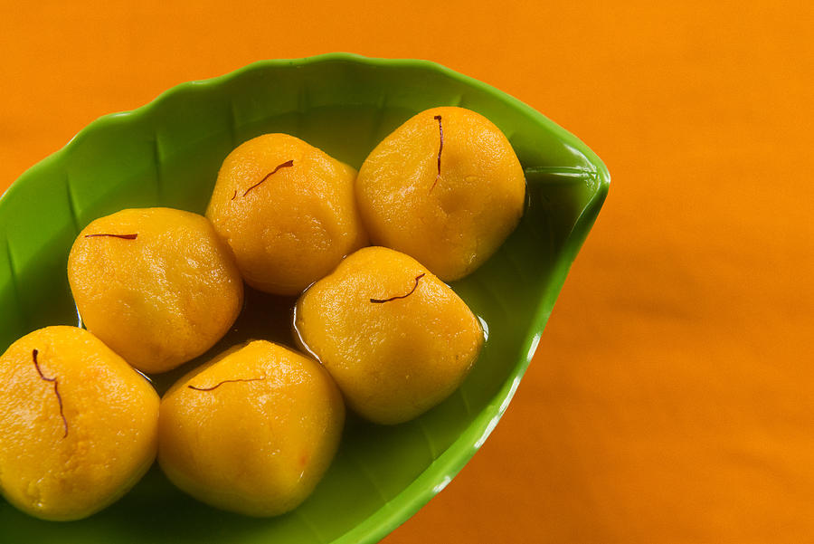 Kamala-Bhog is orange flavored Rasgullas on plate. Photograph by Subir Basak