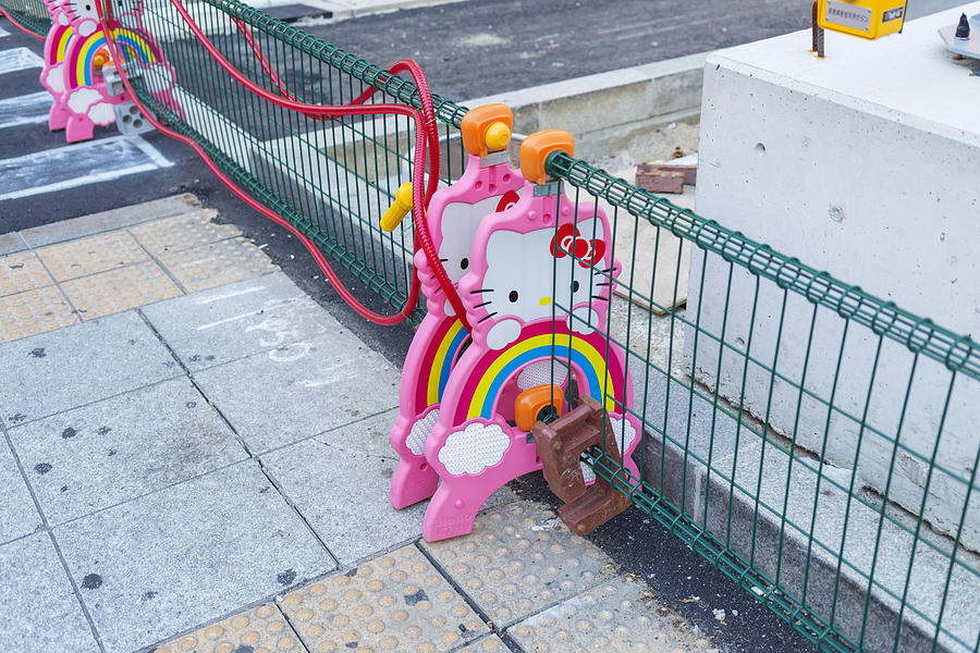 Kawaii Hello Kitty Road Works Barricades in Osaka, Japan Photograph by Davidf