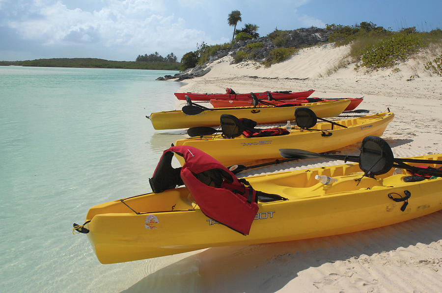 Kayaks in Exhuma, Bahamas Photograph by Bonnie Colgan