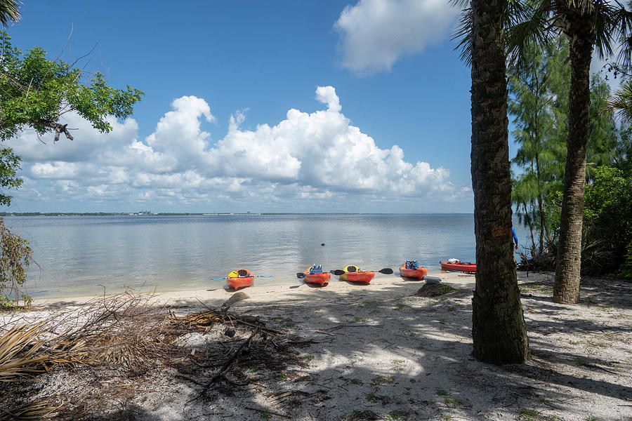 Kayaks on the beach on beautiful Florida day Photograph by Dan Friend
