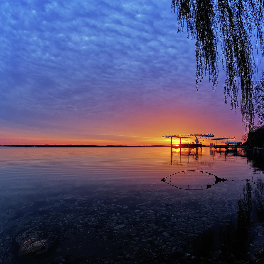 Kegonsa Kalm -  Sunrise at a Lake Kegonsa shoreline with boat docks and calm water Photograph by Peter Herman