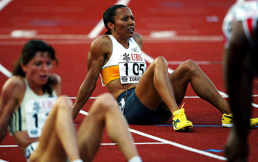 Kelly Holmes of Great Britain sits on the track Photograph by Jamie McDonald