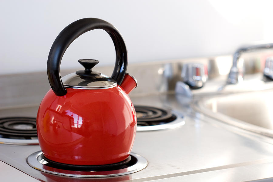 Kettle on Stovetop Photograph by Sangfoto