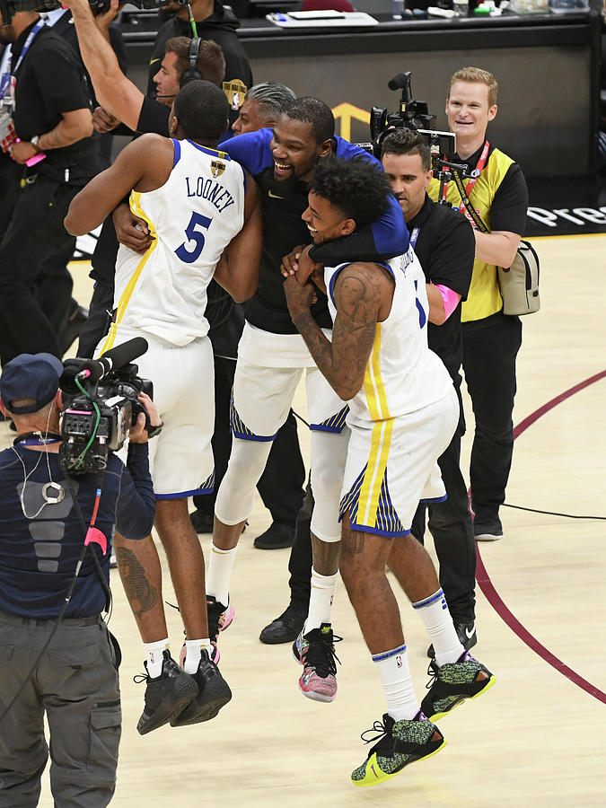 Kevin Durant, Nick Young, and Kevon Looney Photograph by Garrett Ellwood