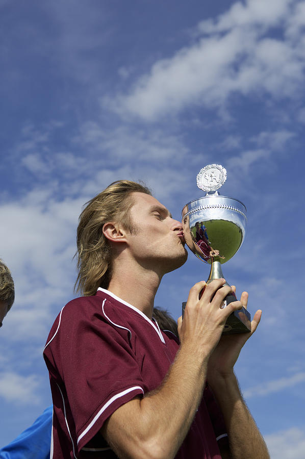 Kicker kissing a cup Photograph by Stock4b-rf