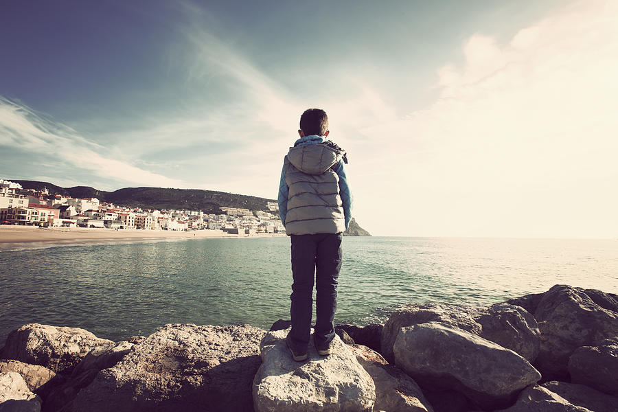 Kid looking to Sesimbra bay Photograph by Nphotos