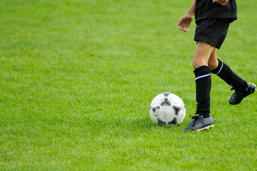 Kid playing soccer Photograph by Mac99