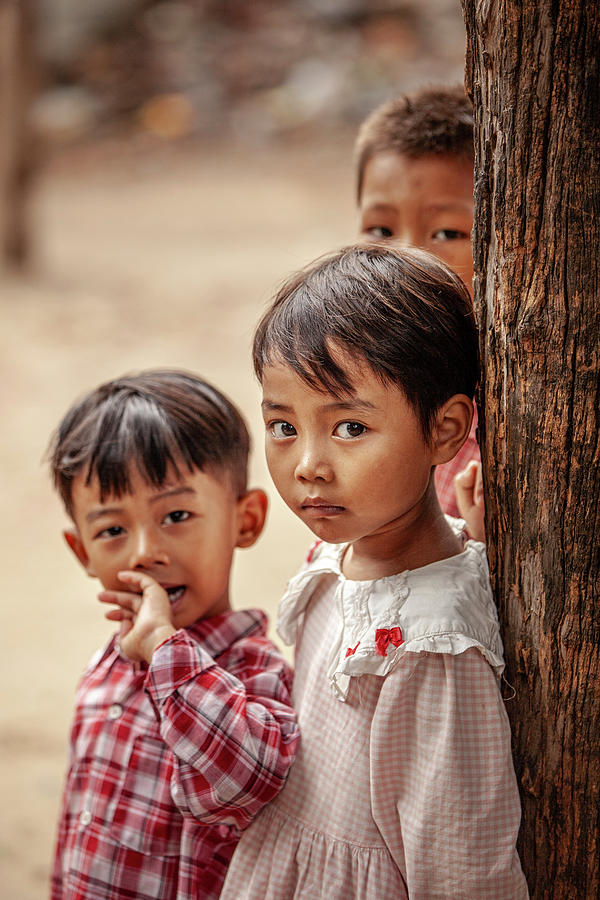 Tree Photograph - Kids against a tree in Mandalay by Ruben Vicente