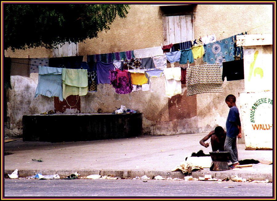 Kids and Clothesline in Senegal Photograph by Wayne King