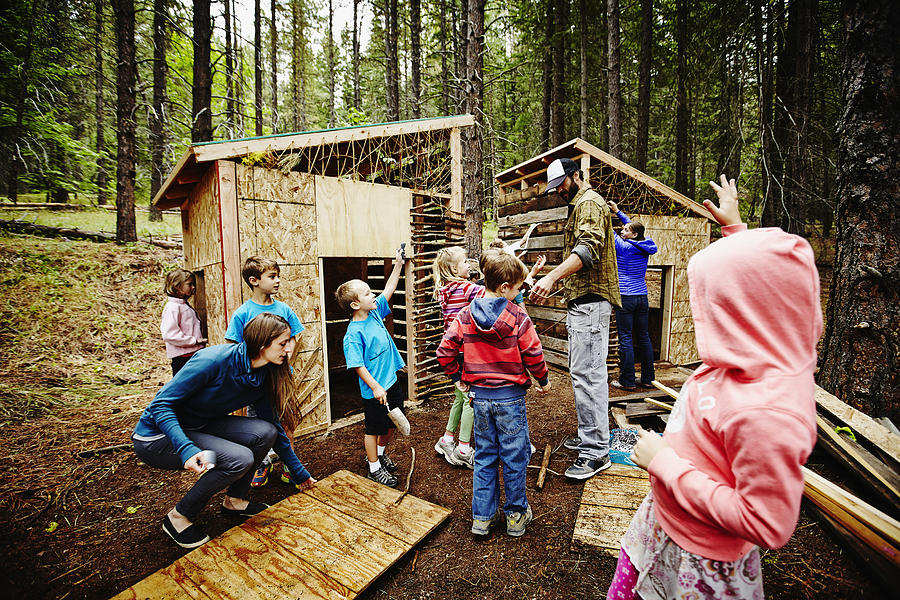 Kids and counselors building fort at camp Photograph by Thomas Barwick