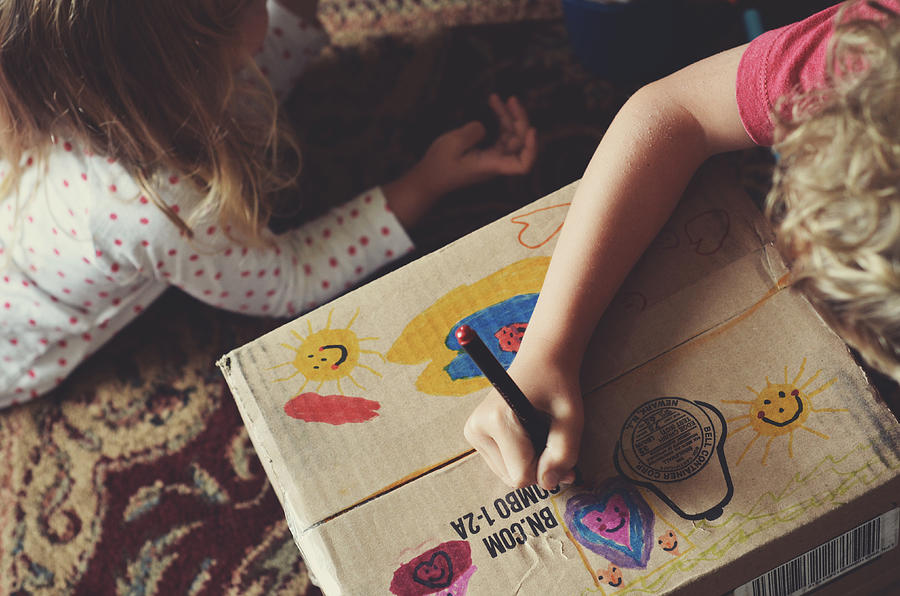 Kids coloring on cardboard box Photograph by photo by Kristin Zecchinelli
