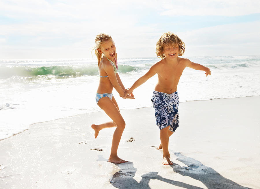 Kids enjoying summer vacation at the beach Photograph by GlobalStock