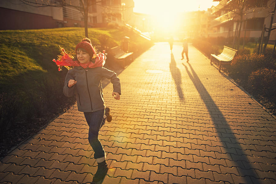 Kids having fun runnin on sunset Photograph by Imgorthand