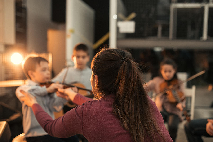 Kids making music in school Photograph by South_agency