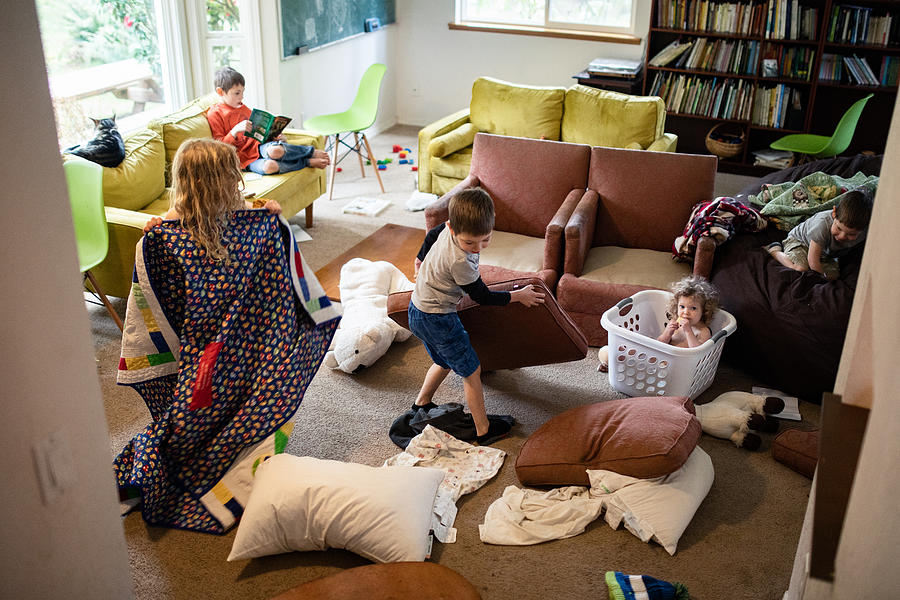 Kids Play and Imagine In Messy Living Room Photograph by RyanJLane