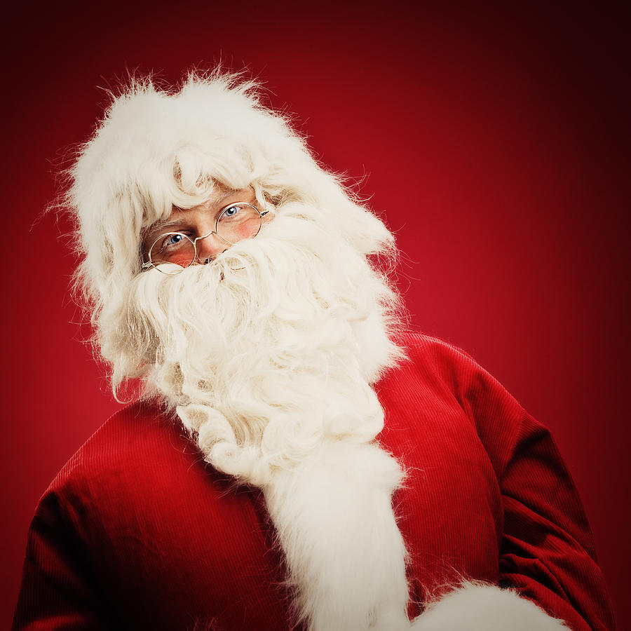 Kind Santa Claus on red background Photograph by Knape