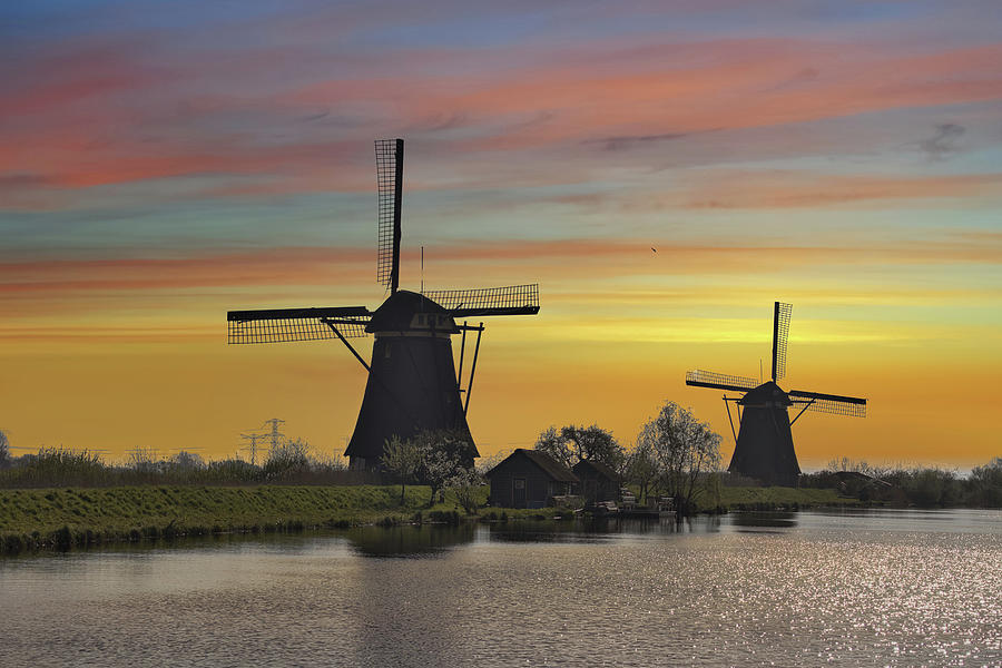 Kinderdijk windmills at sunset Photograph by Pietro Ebner