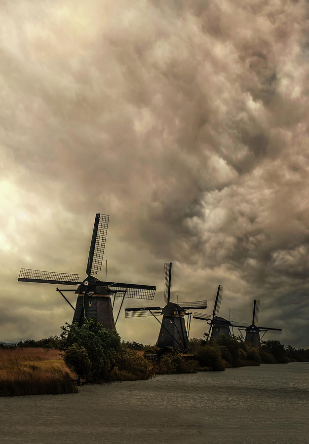Kinderdijk windmills before the storm Photograph by Jaroslaw Blaminsky
