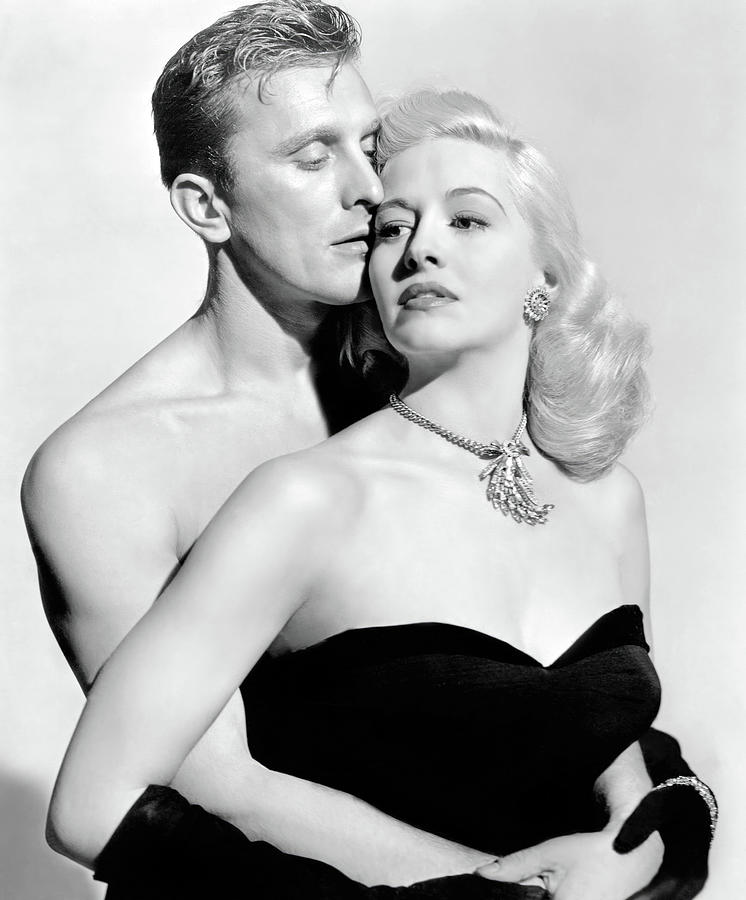 KIRK DOUGLAS and MARILYN MAXWELL in CHAMPION -1949-, directed by MARK ROBSON. Photograph by Album