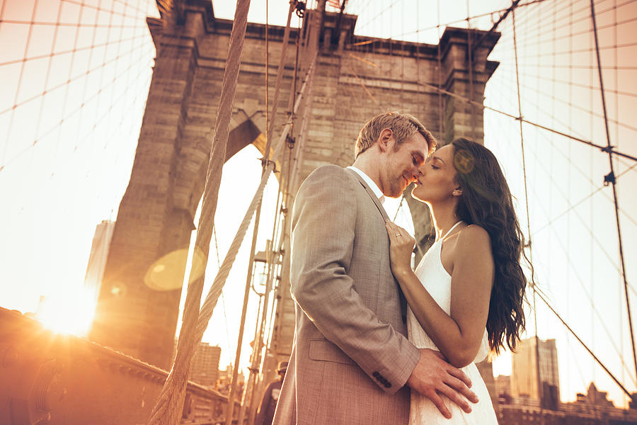 Kiss on Brooklyn Bridge Photograph by Weekend Images Inc.
