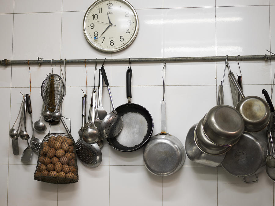 Kitchen wall with eggs, clock and pans Photograph by Eric Gregory Powell