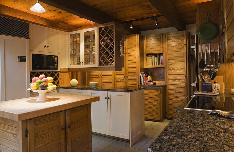 Kitchen with maple wood island Photograph by Perry Mastrovito