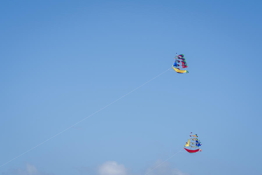Kites in the clear sky of Bali Photograph by Mauro Tandoi