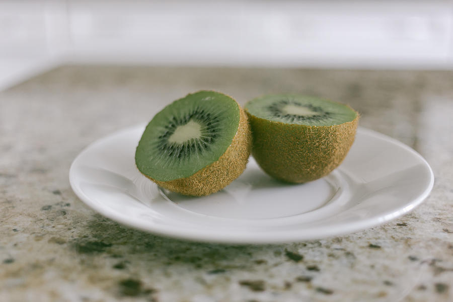 Kiwi Fruit on Saucer Photograph by Grace Cary