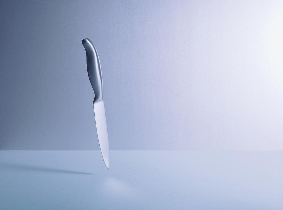 Knife floating Photograph by Martin Barraud