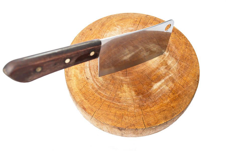 Knife on a wooden butcher on white background Photograph by Villagemoon