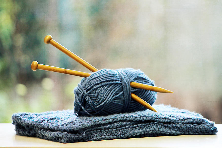 Knitting needles in ball of yarn Photograph by Gregoria Gregoriou Crowe fine art and creative photography.