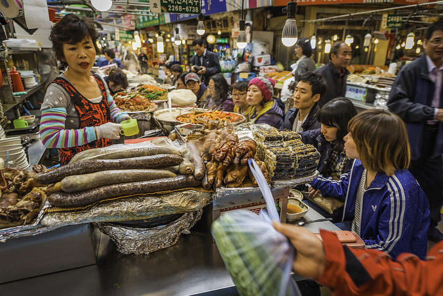 Korea cook and customers at busy market food stall Seoul Photograph by fotoVoyager
