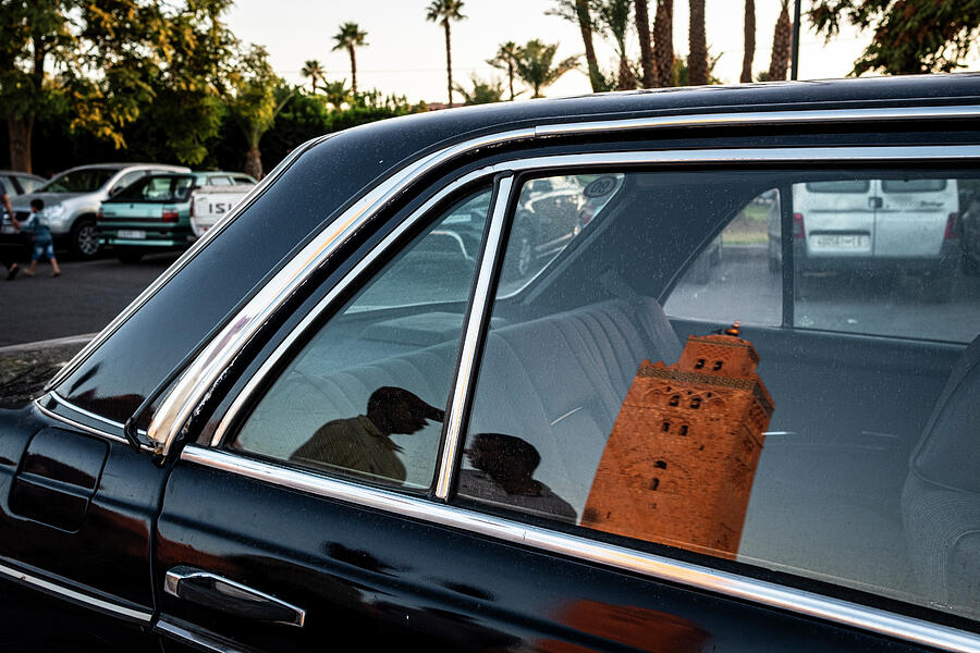 Car Photograph - Koutoubia mosque reflected on the window of a parked car by Ruben Vicente