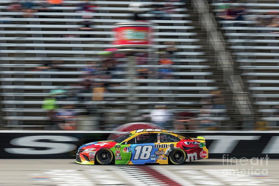 Kyle Busch crossing the finish line Photograph by Paul Quinn