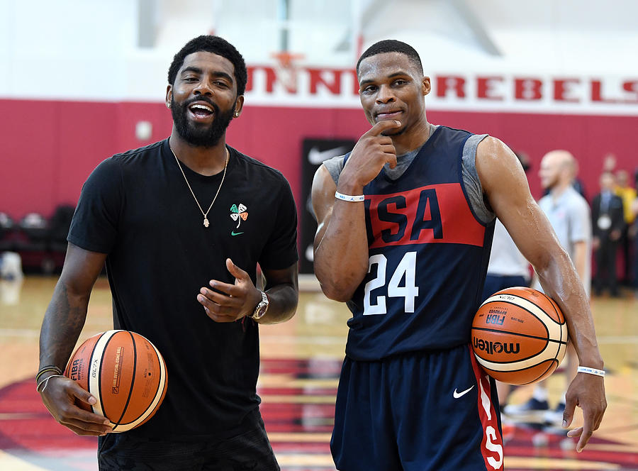 Kyrie Irving and Russell Westbrook Photograph by Ethan Miller