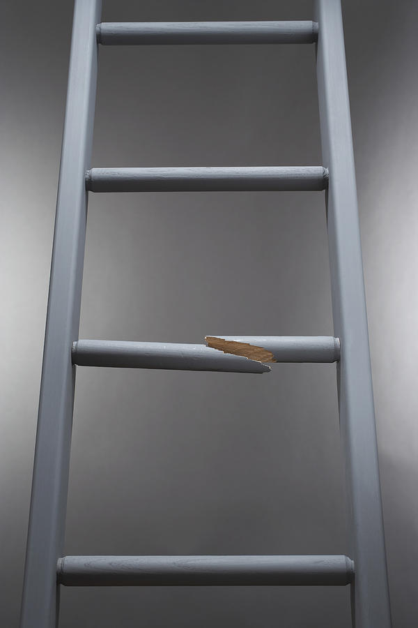 Ladder with one step broken Photograph by Moodboard