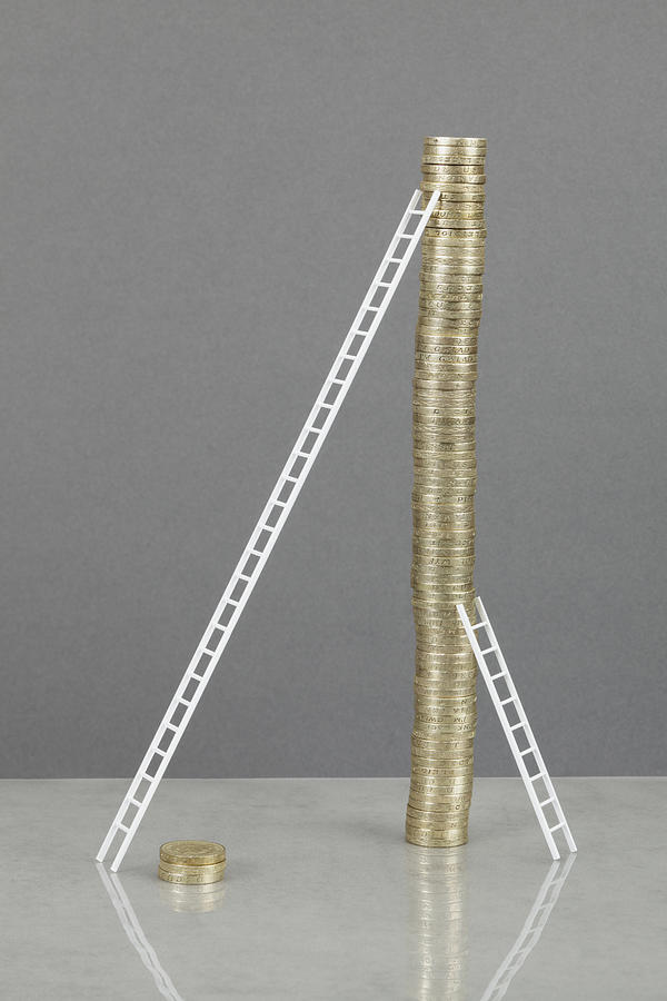 Ladders leaning on stack of coins Photograph by GP Kidd