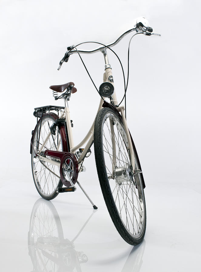 Ladies bicycle on white background Photograph by Howard Kingsnorth