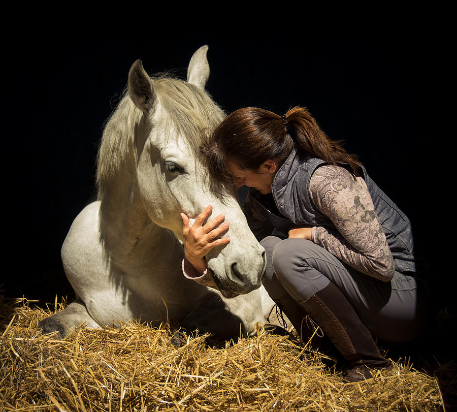 Lady kissing her horse Photograph by By Ana Gassent