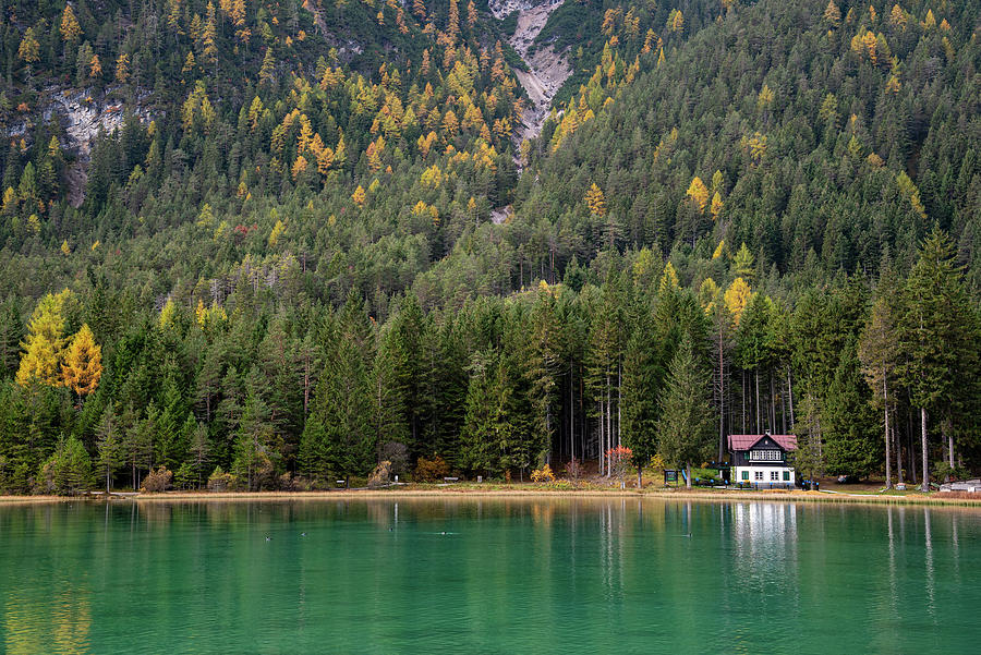 House in the lake and forest. Lago di dobbiaco lake. Italian aps Photograph by Michalakis Ppalis