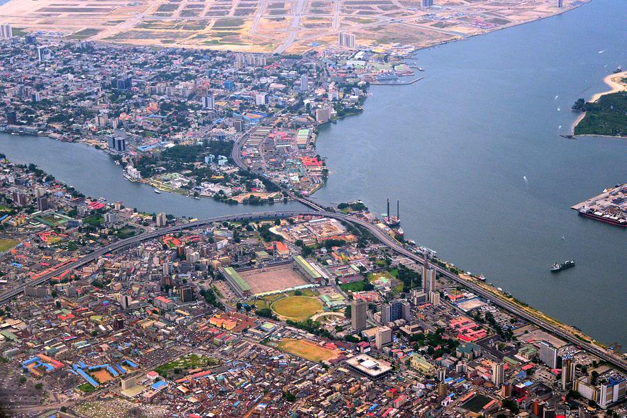 Lagos from the air - Lagos island and Victoria Island - central business district - Lagos Lagoon and Five Cowrie Creek, Nigeria Photograph by Mtcurado